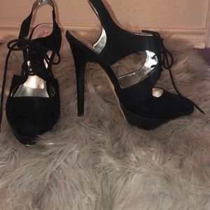 black suede heels. about 5.5-6 inches of heel.